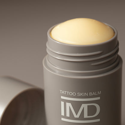 Close-up of IMD Daily Care Tattoo Skin Balm — plant-based, all-natural moisturizer for healed tattoos