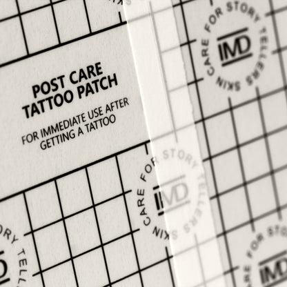 Close-up of IMD Post Care Tattoo Patch — waterproof, breathable film with grid texture for new tattoo aftercare