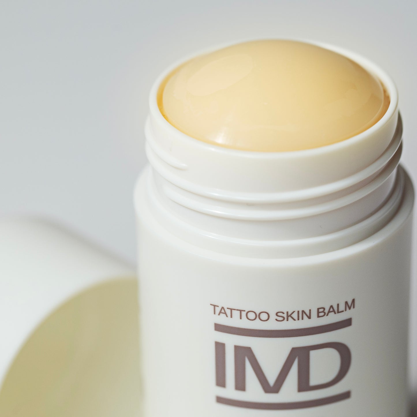 Close-up of IMD Pre Care Tattoo Skin Balm — cruelty-free, plant-based balm to prep skin before getting a tattoo